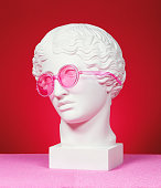 Head sculpture with pink eyeglasses