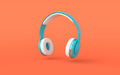 Headphones realistic 3d render. Music lover minimalistic background with blue, white and golden wireless audio earphones
