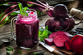 Healthy drink: beet juice on rustic wooden table
