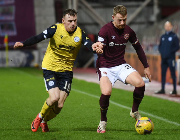 Hearts Stephen Kingsley is challenged by Connor Shields during a Scottish Championship match between Hearts and Queen of the South at Tynecastle, on...