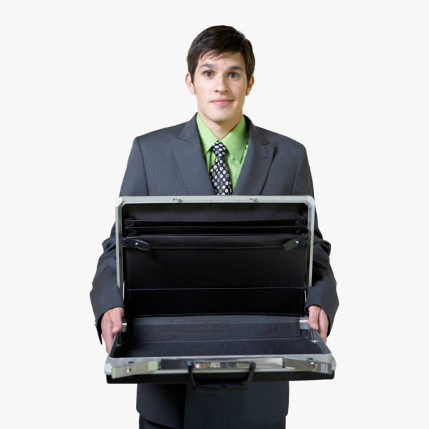 Hispanic businessman holding empty briefcase