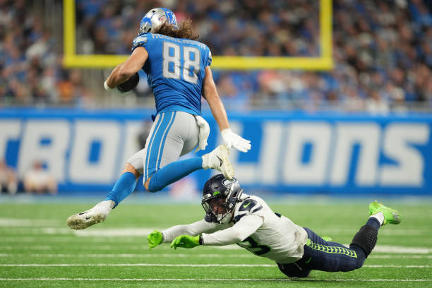 Hockenson of the Detroit Lions misses a tackle by Josh Jones of the Seattle Seahawks during the second half of the game at Ford Field on October 02,...
