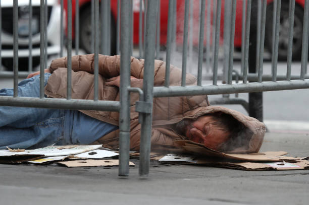 Homeless man sleeps on the sidewalk on December 05, 2019 in San Francisco, California. California Gov. Gavin Newsom announced plans to release $650...