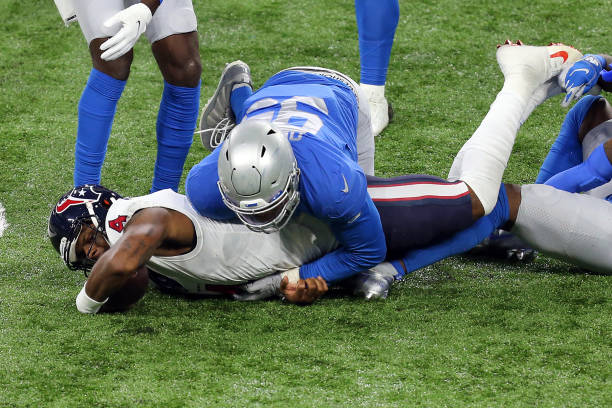 Houston Texans quarterback Deshaun Watson is sacked by Detroit Lions defensive end Romeo Okwara during the second half of an NFL football game...