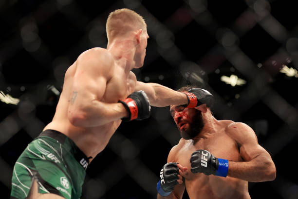 Ian Garry of Ireland punches Gabriel Green in their welterweight bout during UFC 276 at T-Mobile Arena on July 02, 2022 in Las Vegas, Nevada.