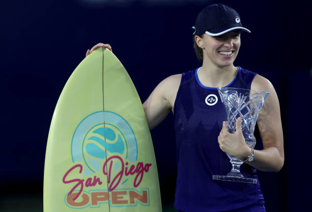 Iga Swiatek of Poland clebebrates with the trophy after defeating Donna Vekic of Czech Republic in the women's singles final during the San Diego...