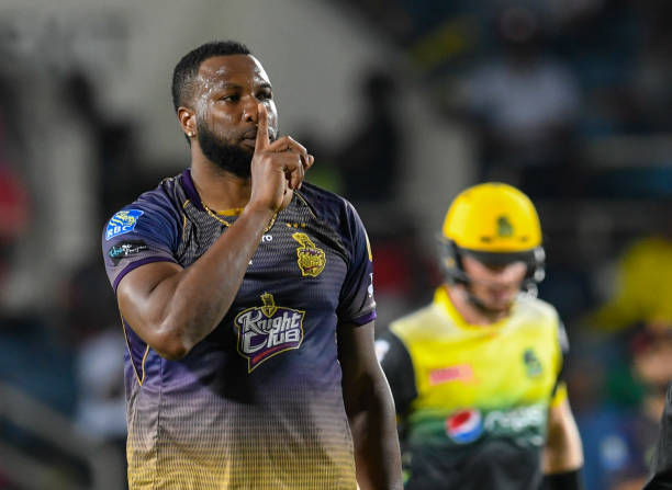 In this handout image provided by CPL T20, Kieron Pollard of Trinbago Knight Riders celebrates the dismissal of Glenn Phillips of Jamaica Tallawahs...