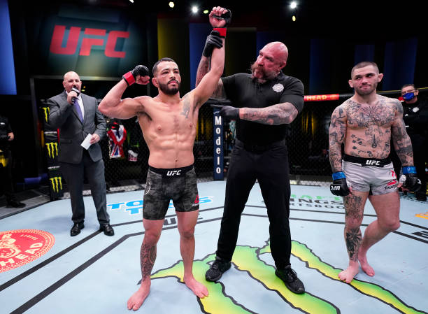 In this handout image provided by UFC, Dan Ige reacts after his knockout victory over Gavin Tucker of Canada in a featherweight fight during the UFC...