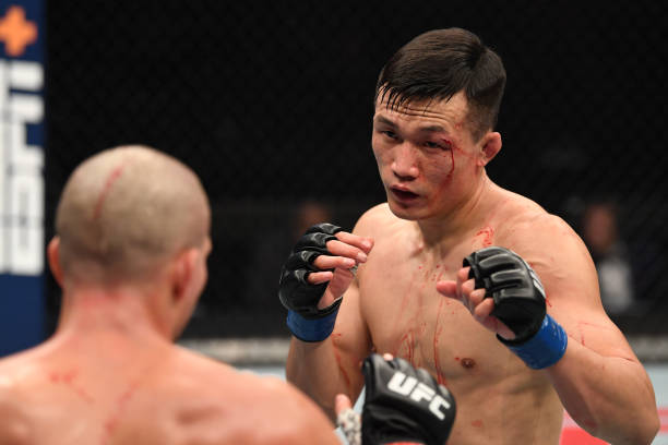 In this handout image provided by UFC, The Korean Zombie Chan Sung Jung battles Brian Ortega in their featherweight bout during the UFC Fight Night...