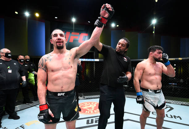 In this handout photo, Robert Whittaker of Australia reacts after his victory over Kelvin Gastelum in a middleweight fight during the UFC Fight Night...