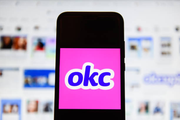 in this photo illustration an okcupid logo seen displayed on a picture