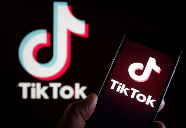 In this photo illustration the logo of Chinese media app for creating and sharing short videos,TikTok, also known as Douyin is displayed on the...