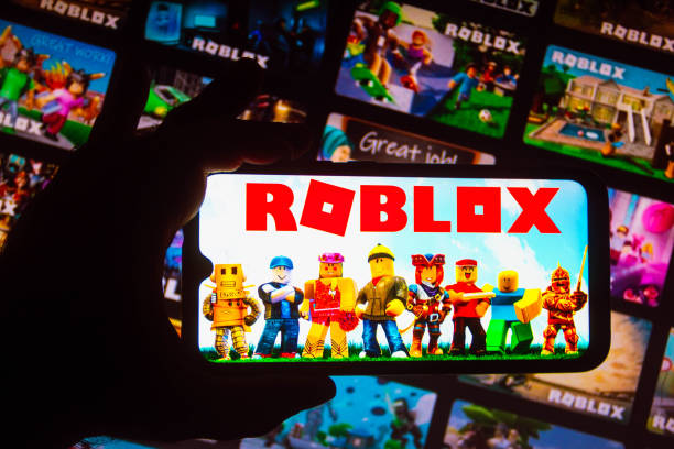 In this photo illustration the Roblox logo seen displayed on a smartphone.