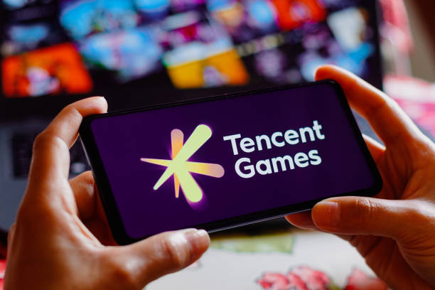 In this photo illustration, the Tencent Games logo is displayed on a smartphone screen.