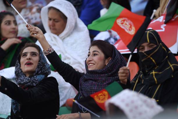 In this photograph taken on September 21 Afghan football fans watch a Roshan Afghan premiere league match between Toofan Harirod and Simorgh Alborz...