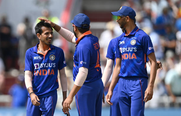 India captain Rohit Sharma congratulates bowler Yuzvendra Chahal after he had bowled England batsman Reece Topley during the 3rd Royal London Series...