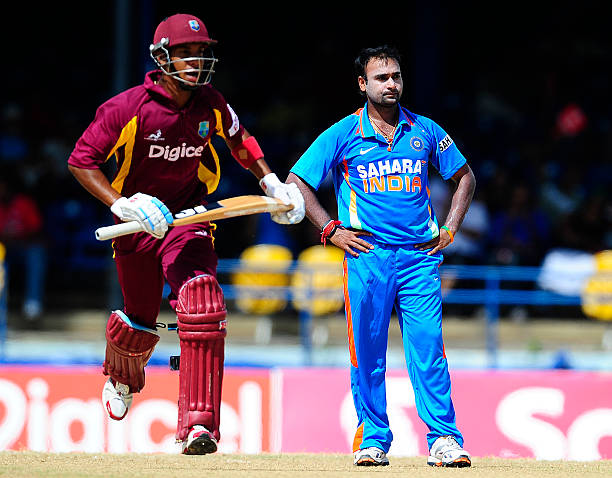 Indian bowler Amit Mishra reacts as West Indies batsman Lendl Simmons scores a run during the second ODI between West Indies and India at the Queen's...