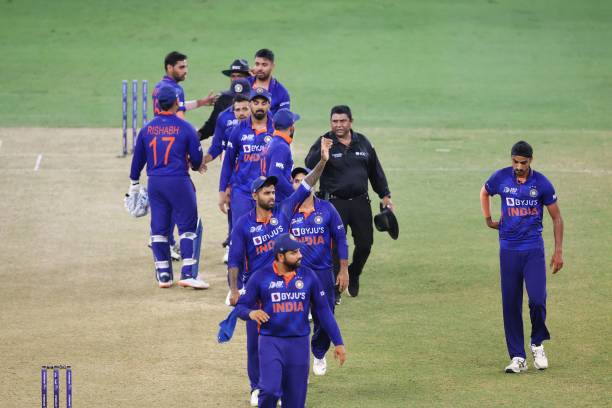 India's players leave the field after wnning the Asia Cup Twenty20 international cricket match between India and Hong Kong at the Dubai International...