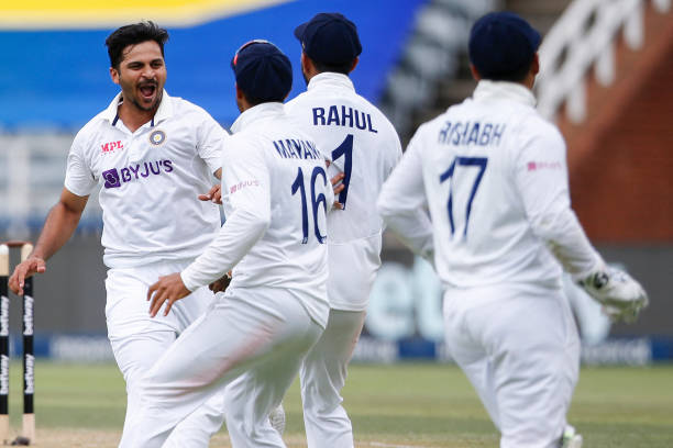 India's Shardul Thakur celebrates with teammates after the dismissal of South Africa's Temba Bavuma during the second day of the second Test cricket...