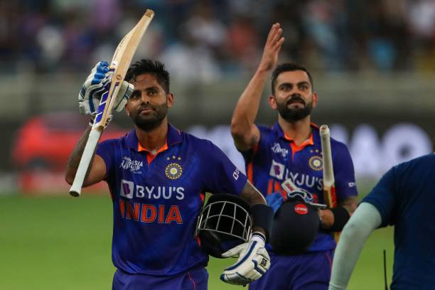India's Virat Kohli and his teammate Suryakumar Yadav leave the field after their innings during the Asia Cup Twenty20 international cricket match...