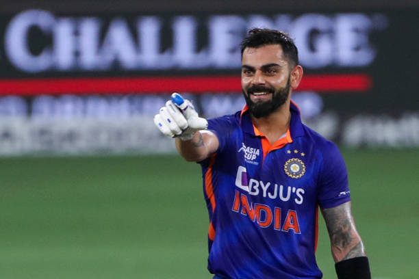 India's Virat Kohli celebrates after scoring a century during the Asia Cup Twenty20 international cricket Super Four match between Afghanistan and...