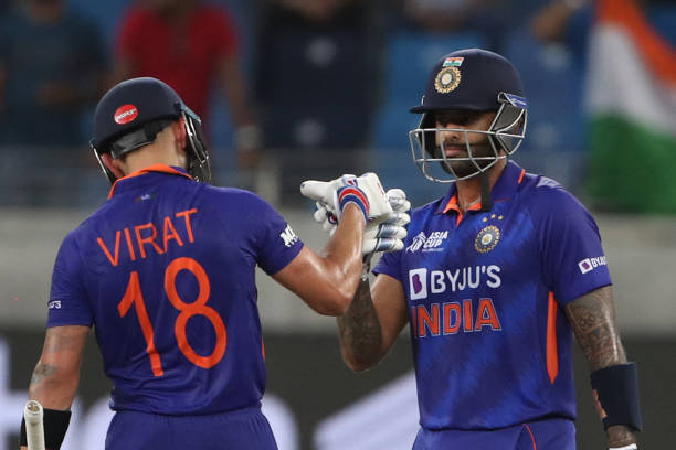 India's Virat Kohli congratulates his teammate Suryakumar Yadav after his half-century during the Asia Cup Twenty20 international cricket match...