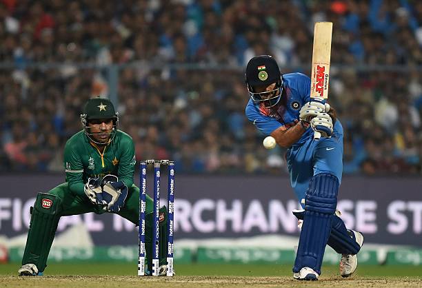 India's Virat Kohliplays a shot as Pakistan's Sarfaraz Ahmed looks on during the World T20 cricket tournament match between India and Pakistan at the...