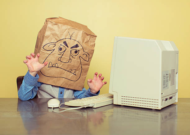 internet troll is mean at the computer - troll stock pictures, royalty-free photos & images