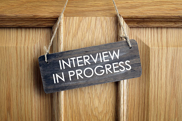 Interview in progress sign on office door