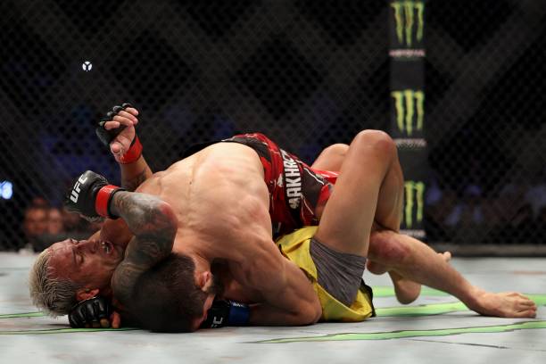 Islam Makhachev competes against Charles Oliveira in the lightweight championship at the Ultimate Fighting Championship event at the Etihad Arena in...