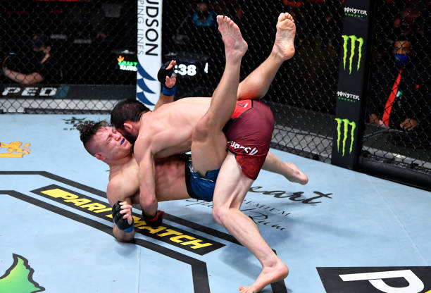 Islam Makhachev takes down Drew Dober in their lightweight fight during the UFC 259 event at UFC APEX on March 06, 2021 in Las Vegas, Nevada.