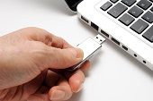 Isolated shot of connecting USB flash drive on white background