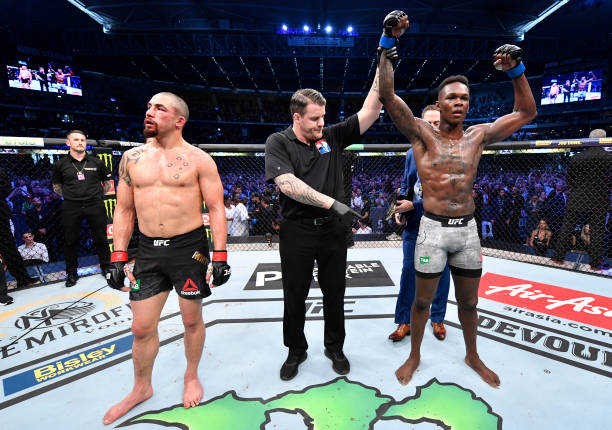 Israel Adesanya of Nigeria celebrates after his knockout victory over Robert Whittaker of New Zealand in their UFC middleweight championship fight...