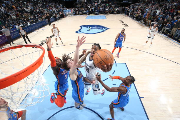 Ja Morant of the Memphis Grizzlies shoots the ball against the Oklahoma City Thunder on December 20, 2021 at FedExForum in Memphis, Tennessee. NOTE...