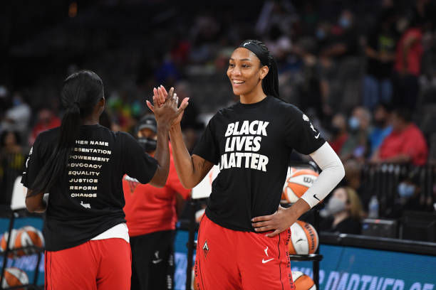 Ja Wilson of the Las Vegas Aces high fives Jackie Young before the game against the Minnesota Lynx on September 8, 2021 at the Michelob ULTRA Arena...
