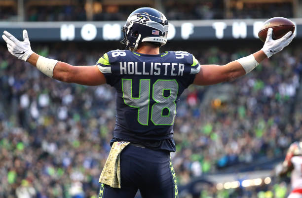 Jacob Hollister of the Seattle Seahawks celebrates after scoring the game-winning touchdown in overtime against the Tampa Bay Buccaneers during a...