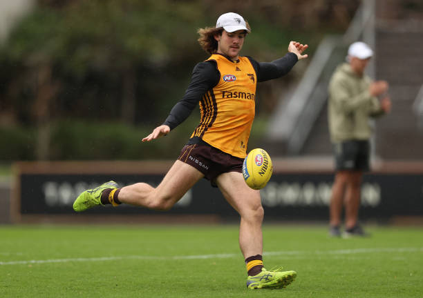 Jai Newcombe of the Hawks kicks the ball during a Hawthorn Hawks AFL training session at Waverley Park on May 04, 2022 in Melbourne, Australia.