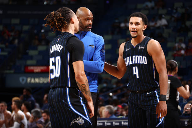 Jalen Suggs of the Orlando Magic talks to his coach and teammate during the game against the New Orleans Pelicans during a preseason game on October...