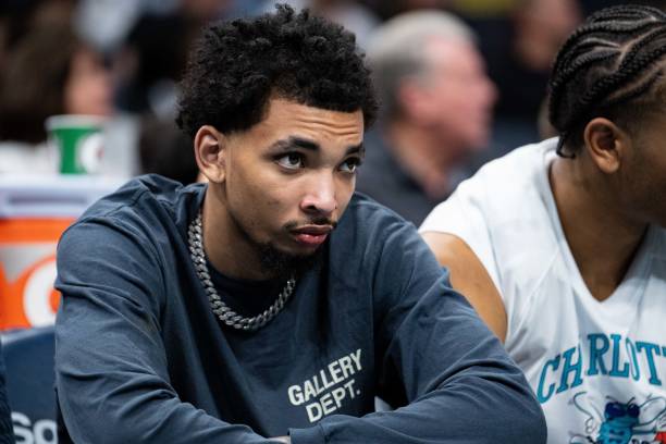 James Bouknight of the Charlotte Hornets looks on during their game against the Dallas Mavericks at Spectrum Center on March 19, 2022 in Charlotte,...