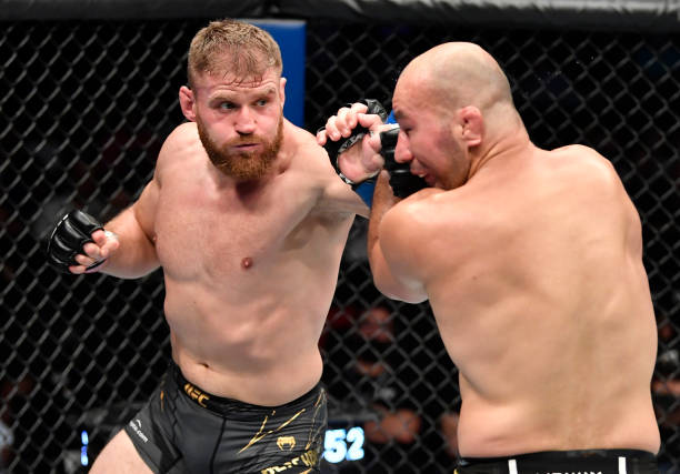 Jan Blachowicz of Poland punches Glover Teixeira of Brazil in the UFC light heavyweight championship fight during the UFC 267 event at Etihad Arena...