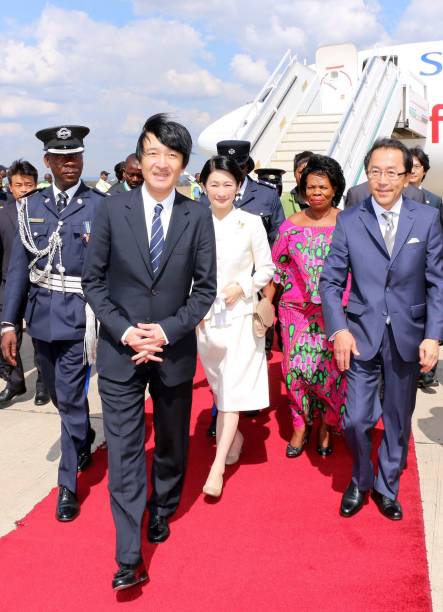 Japanese Imperial Highness Prince Akishino walks with his wife Princess Kiko alongside Zambian Chiefs and traditional affairs minister professor...