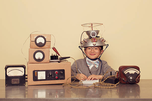 japanese nerd boy wearing mind reading helmet - asian genius little boy having experiment stock pictures, royalty-free photos & images