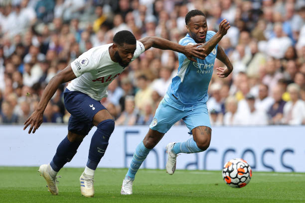 Japhet Tanganga of Tottenham and Raheem Sterling of Man City during the Premier League match between Tottenham Hotspur and Manchester City at...