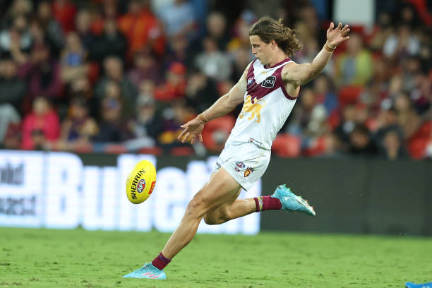 Jarrod Berry of the Lions kicks during the round six AFL match between the Gold Coast Suns and the Brisbane Lions at Metricon Stadium on April 24,...