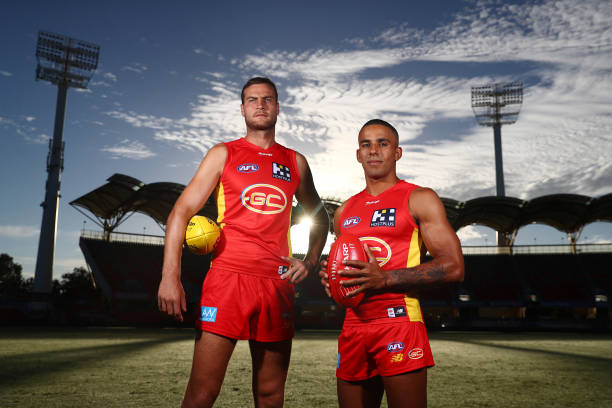 Jarrod Witts and Touk Miller pose during the Gold Coast Suns AFL captaincy announcement at Metricon Stadium on February 21, 2022 in Gold Coast,...