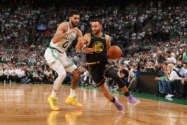 Jayson Tatum of the Boston Celtics plays defense on Stephen Curry of the Golden State Warriors during Game Four of the 2022 NBA Finals on June 10,...