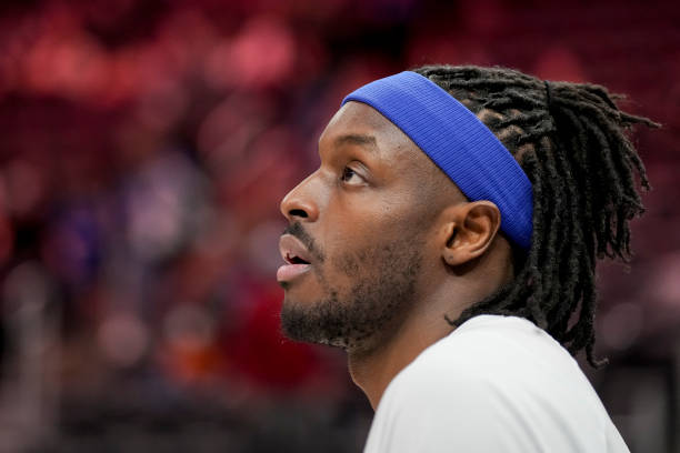 Jerami Grant of the Detroit Pistons looks on before the game against the Washington Wizards at Little Caesars Arena on March 25, 2022 in Detroit,...