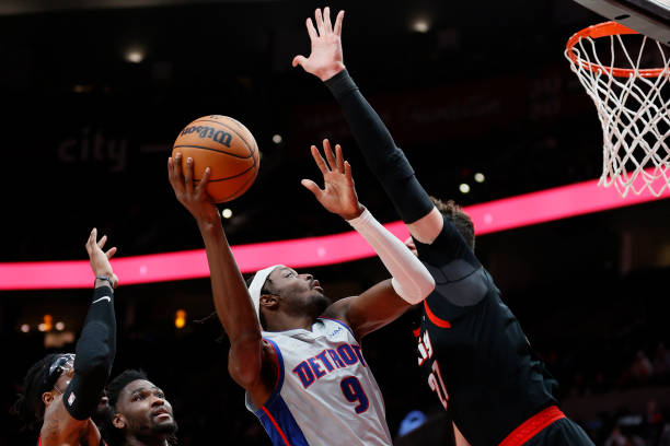 Jerami Grant of the Detroit Pistons shoots against Jusuf Nurkic of the Portland Trail Blazers during the third quarter at Moda Center on November 30,...