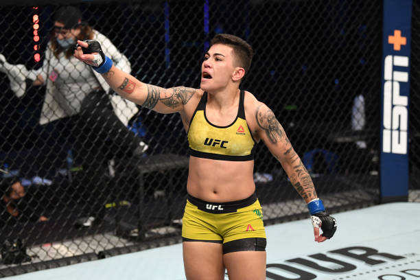 Jessica Andrade of Brazil celebrates her TKO victory over Katlyn Chookagian in their women's flyweight bout during the UFC Fight Night event inside...