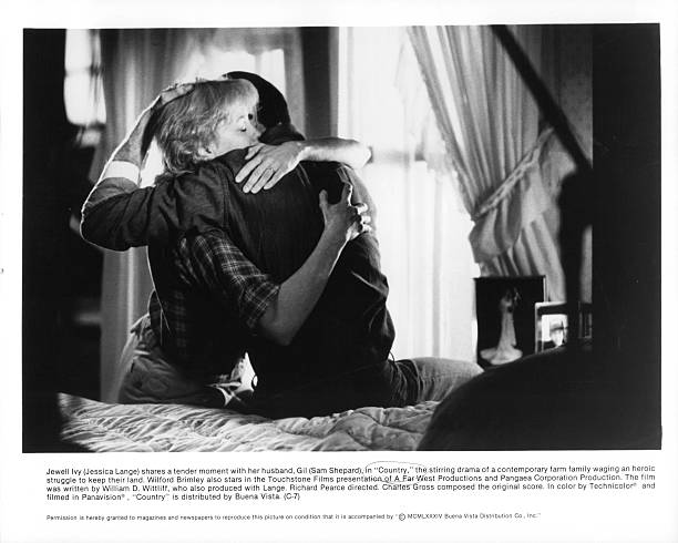 Jessica Lange And Sam Shepard embrace in a scene from the film `Country`, 1984.